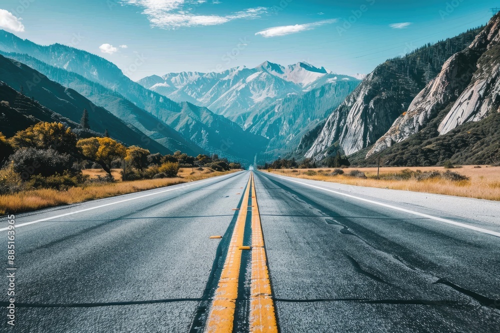 Fototapeta premium Mountain Road With Yellow Lines Leading to the Horizon