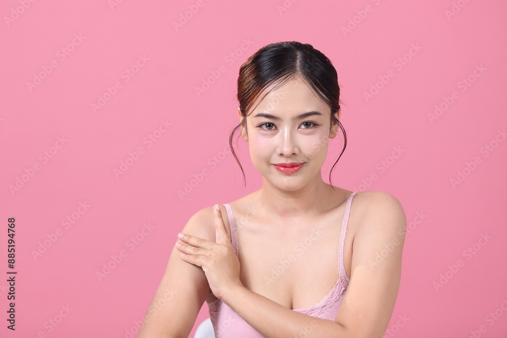 Beautiful young asian woman with clean fresh skin on pink background, Face and skin care Beautiful young asian woman with clean fresh skin on pink background, Face and skin care