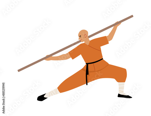 Young man shaolin monk fighter exercising Kung fu fight with wooden stick, Wushu Chinese martial art, practice training