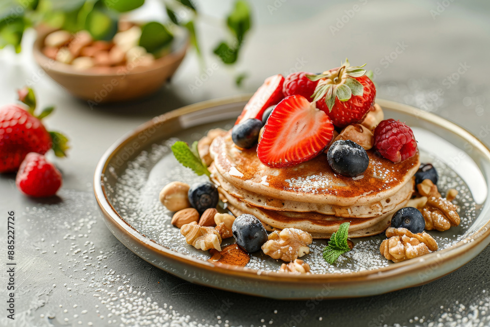Sweet and tasty pancakes with fresh berries, nuts, and drizzled syrup on elegant plate Sweet and tasty pancakes with fresh berries, nuts, and drizzled syrup on elegant plate