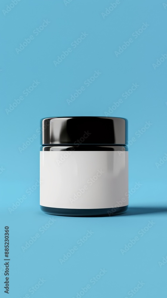 A jar with a white lid sits on a blue background A jar with a white lid sits on a blue background