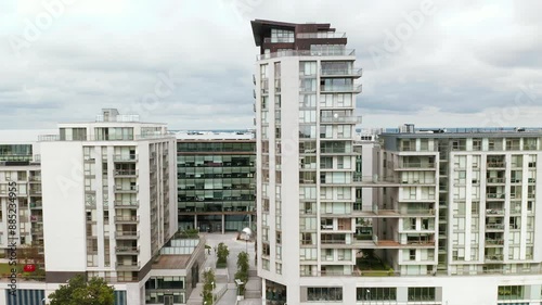 Aerial footage showcasing the contemporary architecture of a modern apartment complex in Leopardstown, Dublin, featuring sleek designs and vibrant urban living spaces.