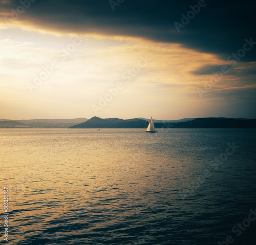 Sailboat on lake Balaton in summer in the sunset