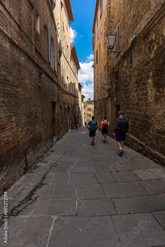 Fototapeta Naklejka Na Ścianę i Meble -  Siena, Italy - June 01, 2024: Narrow street of Siena