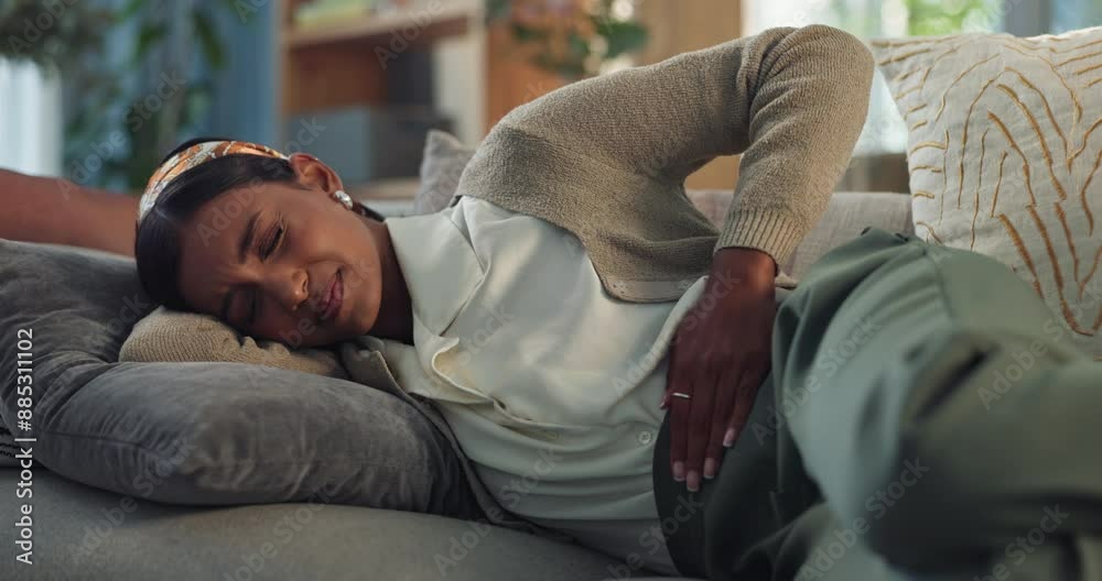 Home, sofa and woman with stomach in pain for indigestion, menstruation and constipation in virus. Living room, person and abdomen with tummy ache for ibs cramps, diarrhea problem and gastro issue