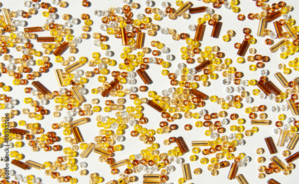 Fototapeta premium Yellow beads background. Yellow beads on white.