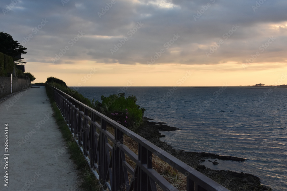 a coastal path and the sunset. sunset over port navalo golf du morbihan france, beauty of morbihan golf. 
