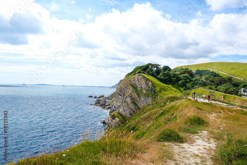 Jurassic coast view in Dorset near Lulworth Cove. Lulworth Cove cliffs view on a way to Durdle Door. The Jurassic Coast is a World Heritage Site on the English Channel coast of southern England.Dorset