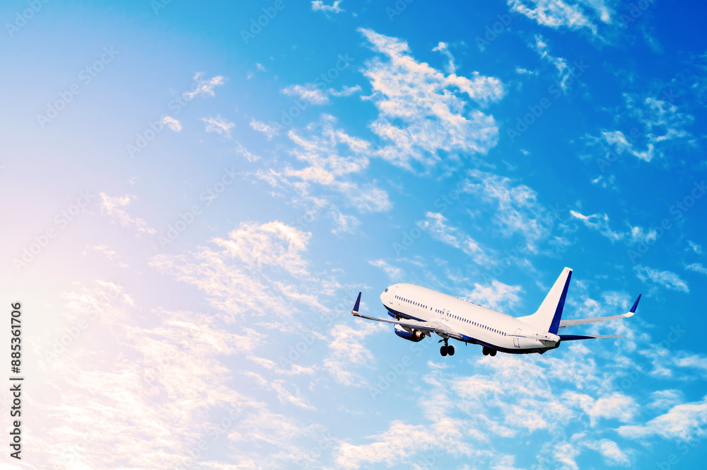 Naklejka premium Airplane flying in the sky, travel background - vacation, business trip, and travel by air concepts