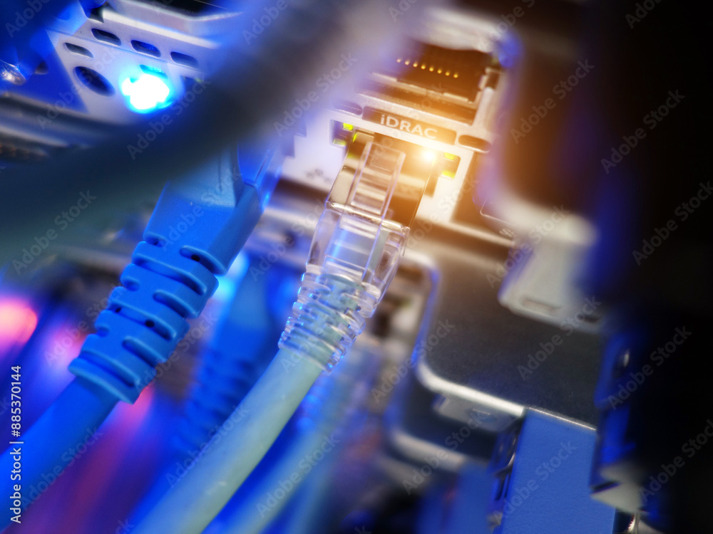network cables connected to switch - closeup of data center hardware technology network cables connected to switch - closeup of data center hardware technology