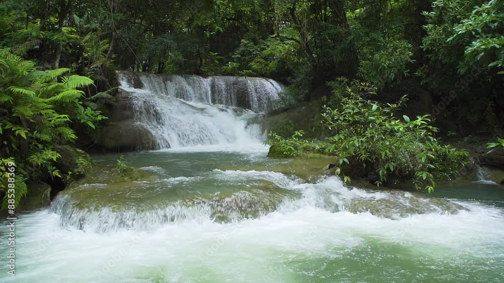 Huai Mae Khamin Waterfall, second level, wild tropical forest in National Park, Kanchanaburi, Thailand - Slow Motion Huai Mae Khamin Waterfall, second level, wild tropical forest in National Park, Kanchanaburi, Thailand - Slow Motion