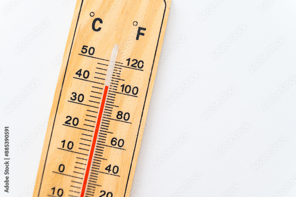 Thermometer on a light surface, indicating high temperature. Global warming.
Thermometer on a light surface, indicating high temperature. Global warming.