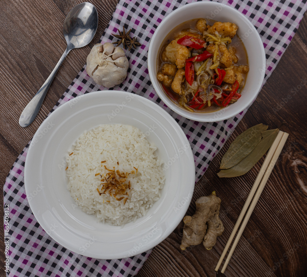 ginger chicken with rice, with uncooked ingredients as garnish ginger chicken with rice, with uncooked ingredients as garnish
