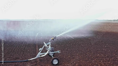 watering the field
 photo