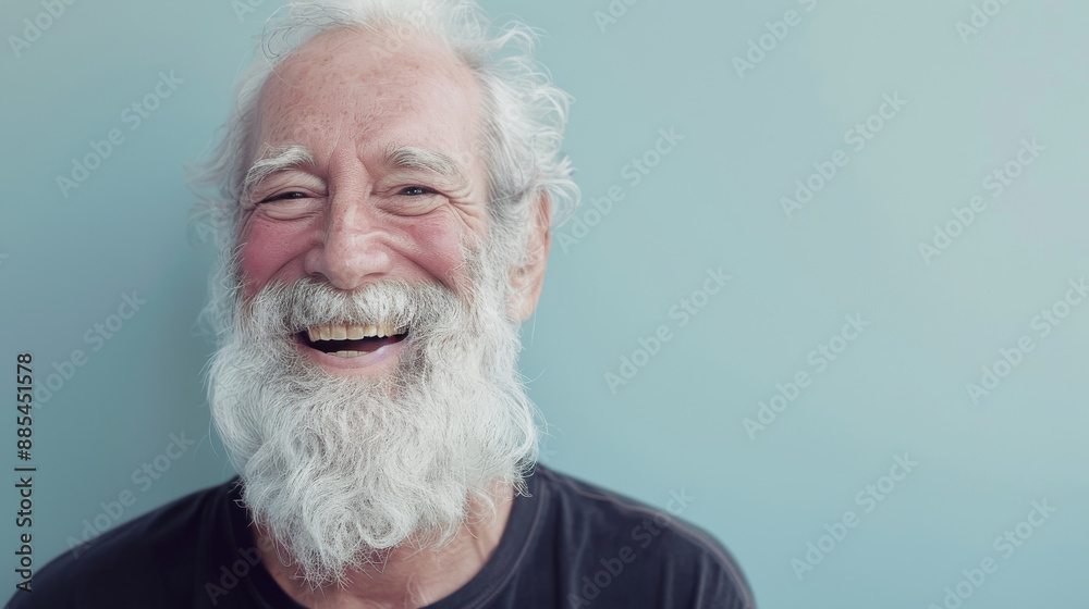 A joyful elderly man with white hair and beard, laughing heartily against a plain background. A joyful elderly man with white hair and beard, laughing heartily against a plain background.