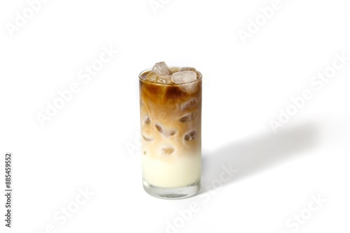 Latte ice coffee serving with milk foam topping in isolated concept.