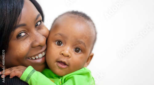 happy smiling african mother hugging her child, large copy space