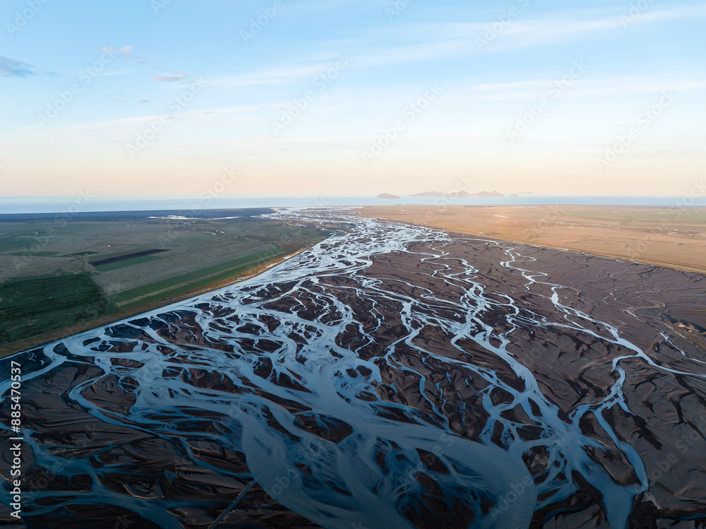 View from above, stunning landscape with a patterns created in the volcanic sands of Iceland as glaciers melt the water flows as rivers out to sea. Natural pattern, wallpaper.