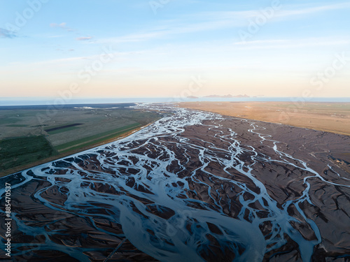 Obraz na płótnie View from above, stunning landscape with a patterns created in the volcanic sands of Iceland as glaciers melt the water flows as rivers out to sea. Natural pattern, wallpaper. w salonie