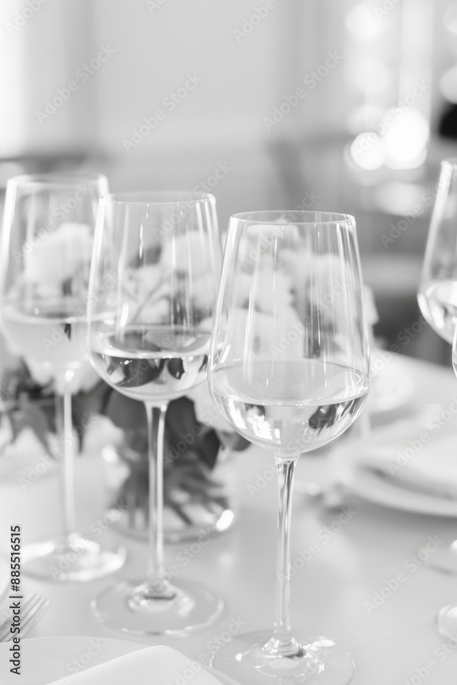 Elegant Monochrome Table Setting with Crystal Wine Glasses and Fine Dining Decor Elegant Monochrome Table Setting with Crystal Wine Glasses and Fine Dining Decor
