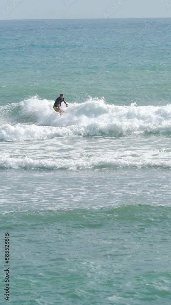 Male surfer in ocean practicing cutback tricks on short surfboard. Male surfer in ocean practicing cutback tricks on short surfboard.