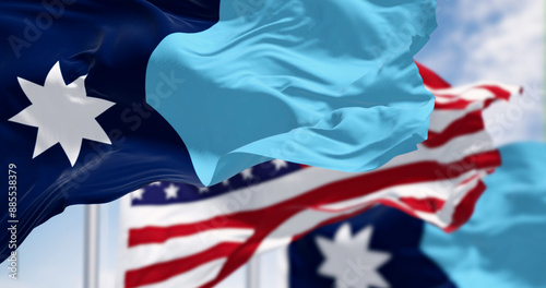 Close-up of Minnesota new state flag waving with the american flag on a clear day