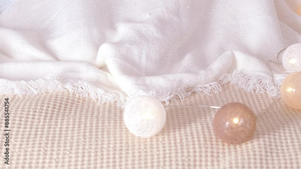Woman covering herself with blanket, close-up feet in blue socks, dozing on bed in peaceful setting, garland balls for coziness, domestic bliss, relaxation retreat, Cozy Comfort Woman covering herself with blanket, close-up feet in blue socks, dozing on bed in peaceful setting, garland balls for coziness, domestic bliss, relaxation retreat, Cozy Comfort