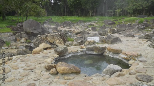Natural hot spring mineral water with steam in Chae Son National Park in the morning, Lampang, Thailand.
