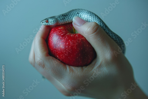 A minimalist animation of a hand holding a red apple with a silver snake coiling up the arm against a plain white background,