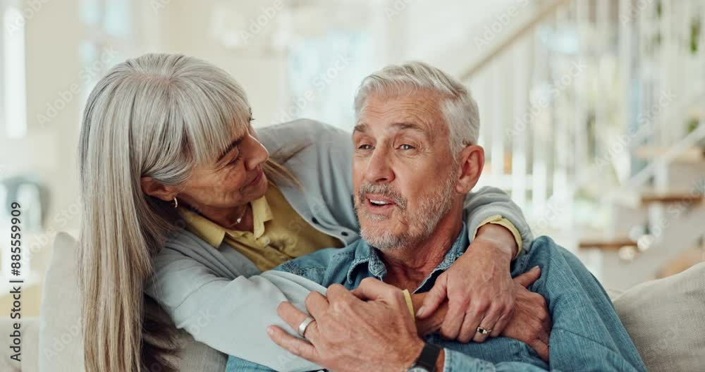 Mature couple, hug and watching tv on sofa with happy marriage, support and talking of pension at home. Man and woman smile on couch for comfort film, movie or show with memory, bonding and break Mature couple, hug and watching tv on sofa with happy marriage, support and talking of pension at home. Man and woman smile on couch for comfort film, movie or show with memory, bonding and break