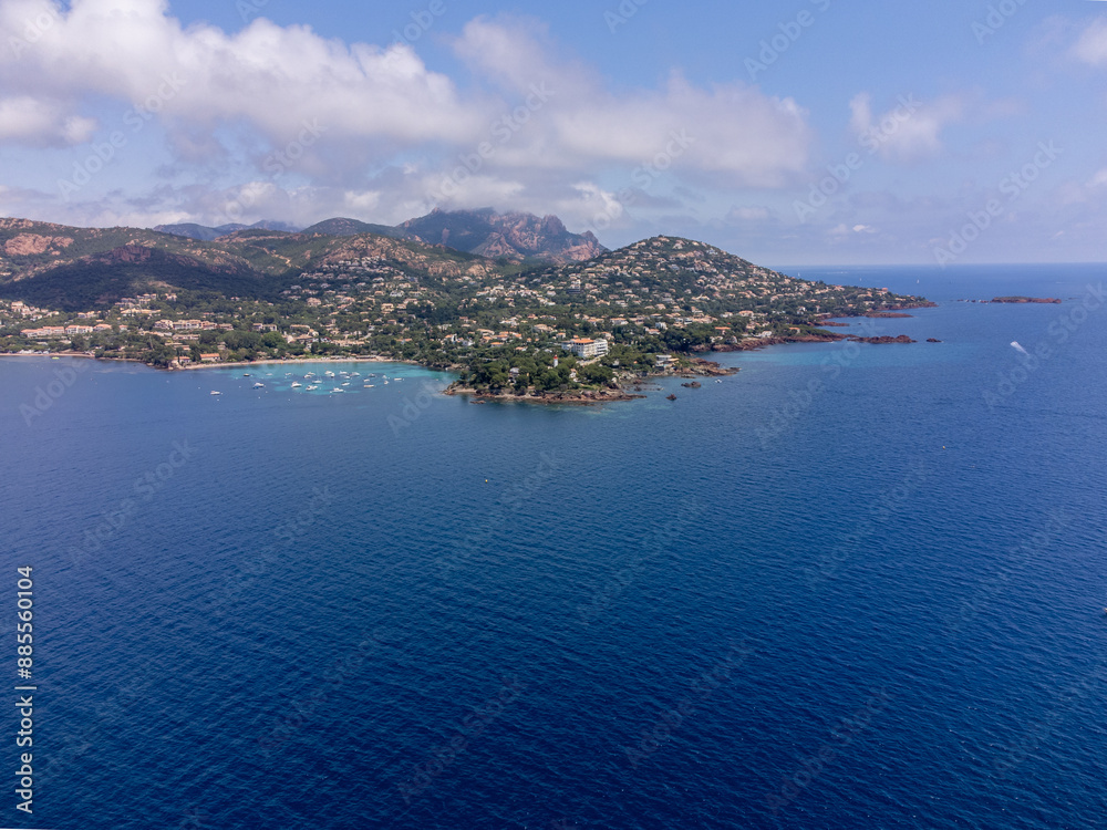 Obraz premium Panoramic view from above on blue Mediterranean dea, sandy beach of Agay town, summer vacation destination near Esterel mountains, French Riviera, Provence. France