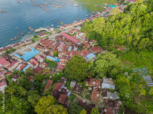 Aerial drone view of small town by  Toba Lake side at Haranggaol in Simalungun, Sumatra Utara, Indonesia photo