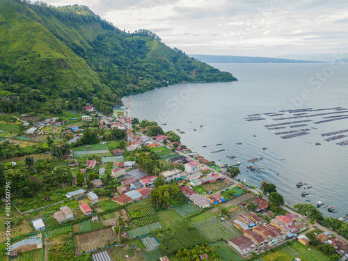 Aerial drone view of small town by  Toba Lake side at Haranggaol in Simalungun, Sumatra Utara, Indonesia photo