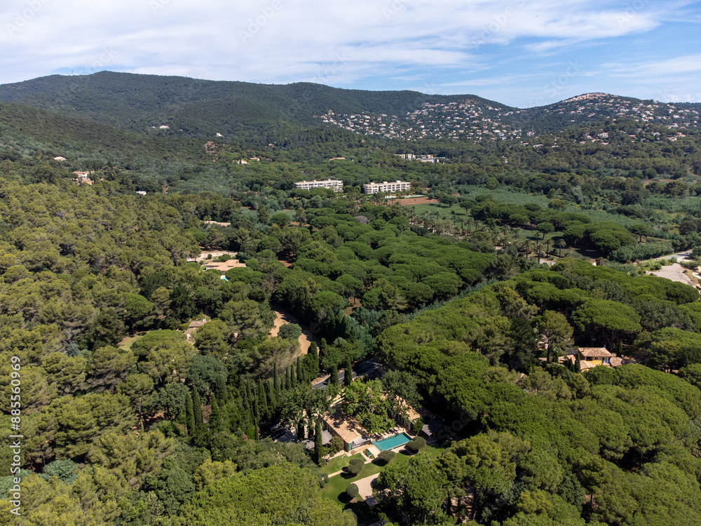 Aerial view on green heuverls with houses  near Cavalaire-sur-Mer and La Croix-Valmer, summer vacation on French Riviera, Var, France