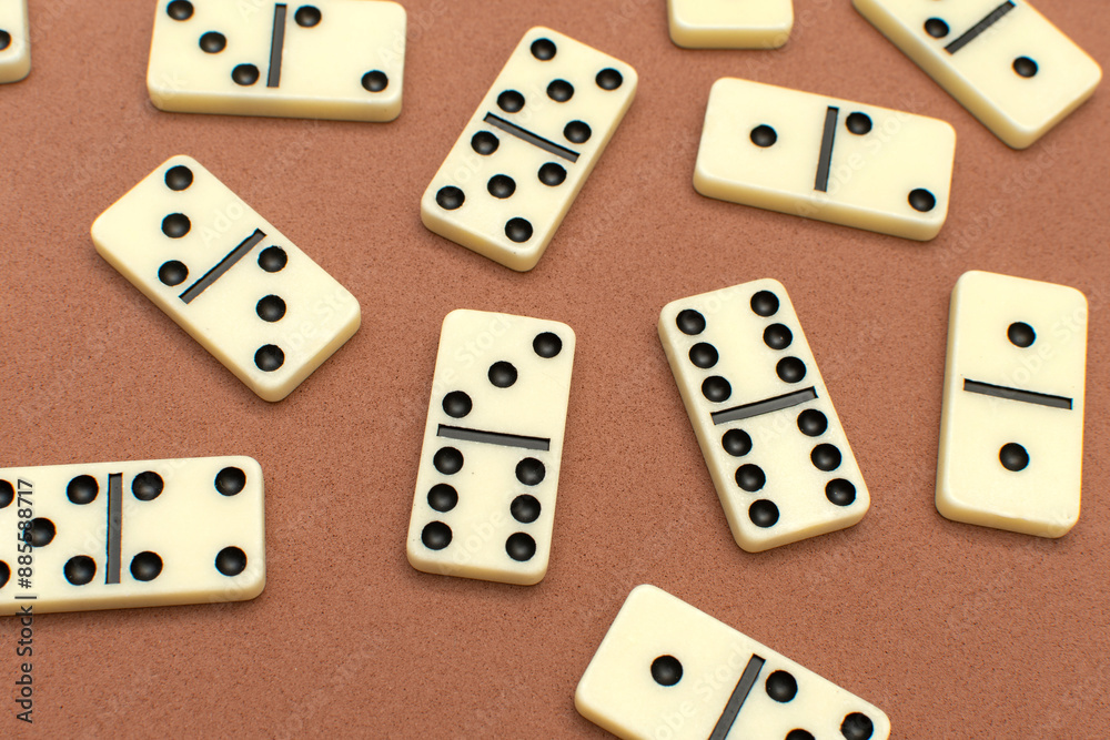 Dominoes bones on brown background Dominoes bones on brown background