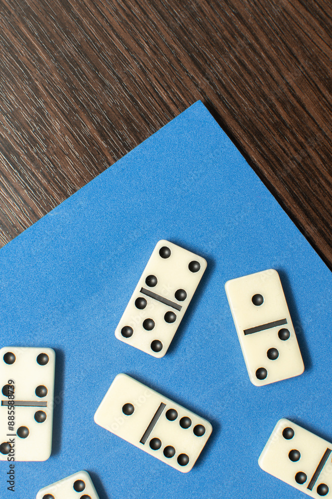 Dominoes bones on blue background Dominoes bones on blue background