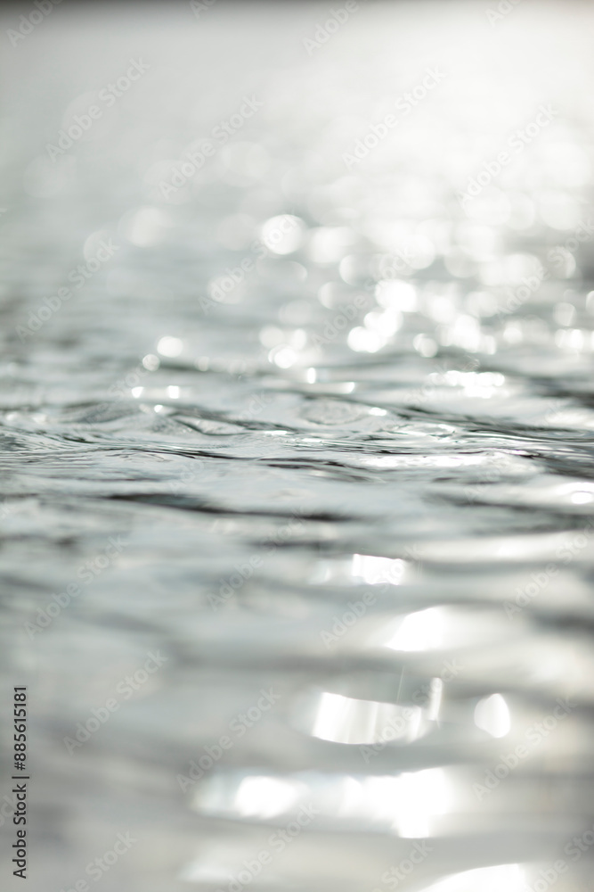 Close-up of sunlight reflecting on rippling water Close-up of sunlight reflecting on rippling water