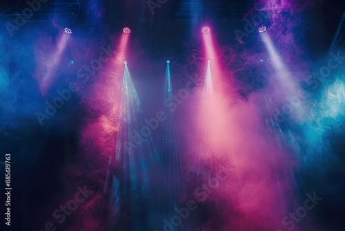 A stage with four lights and a lot of smoke.