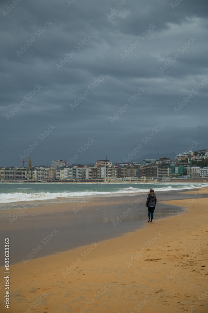 people walking on the beach in San Sebastian people walking on the beach in San Sebastian