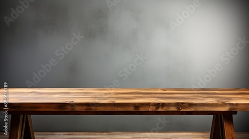 Empty wooden table and gray wall background © Rawstock