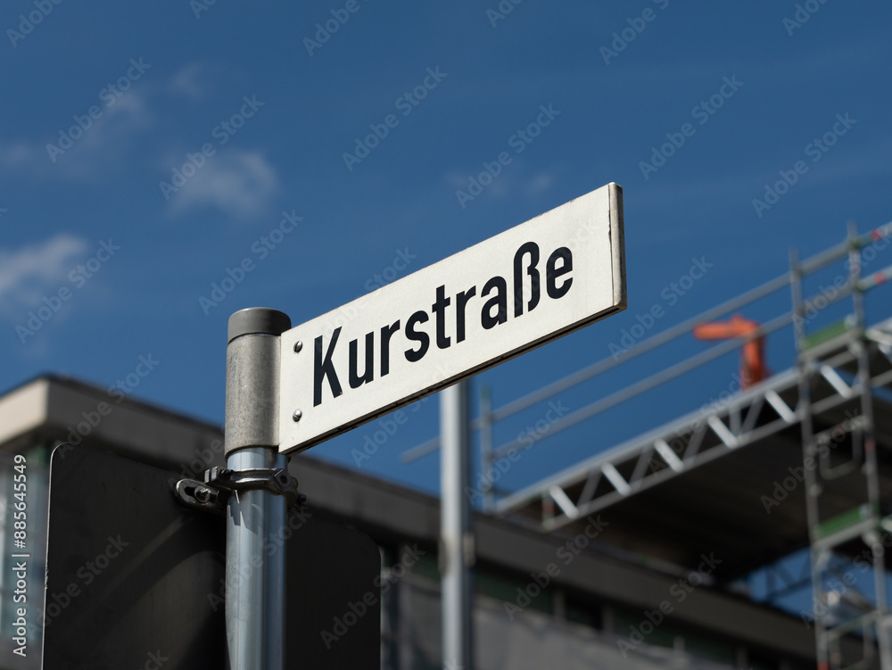 Kurstrasse road name sign in a health resort in Bavaria, Germany. Street signage in German language in a tourist destination. Kurstrasse road name sign in a health resort in Bavaria, Germany. Street signage in German language in a tourist destination.