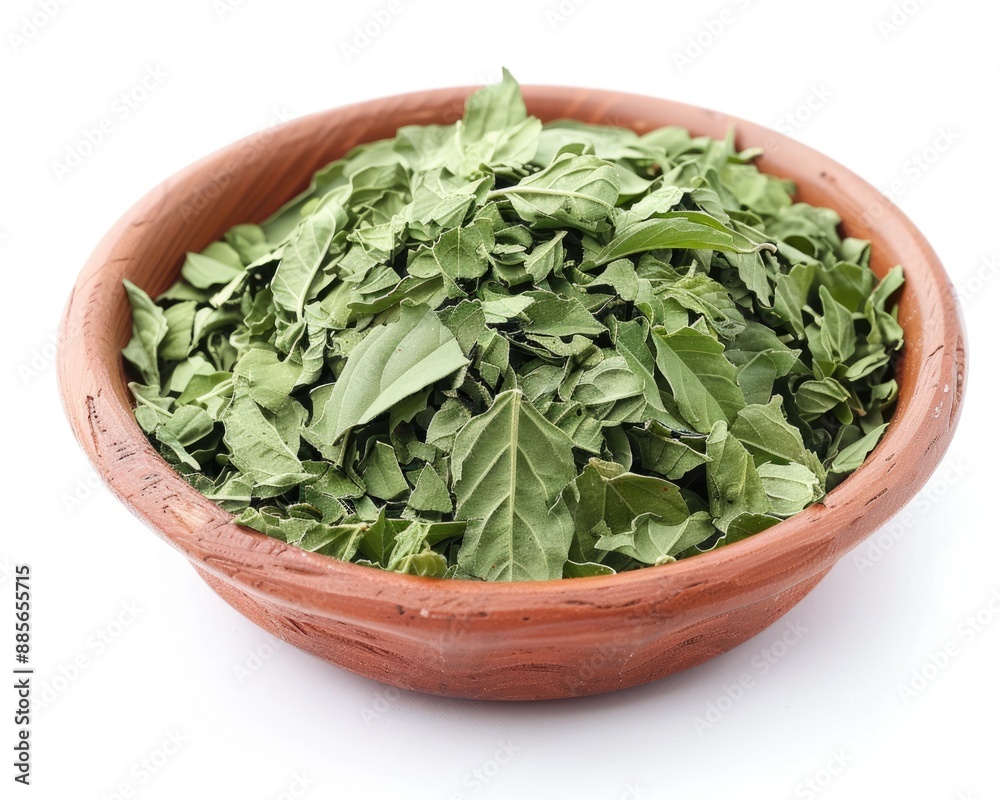 Basil leaves dried. Small bowl with green basil herb seasoning for cooking dish Basil leaves dried. Small bowl with green basil herb seasoning for cooking dish