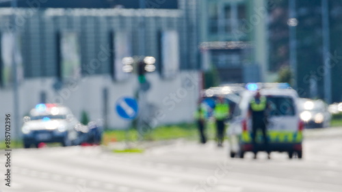 Wallpaper Mural Two police cars and police officers in action. Blurred police scene. Czech police stock photo. Torontodigital.ca