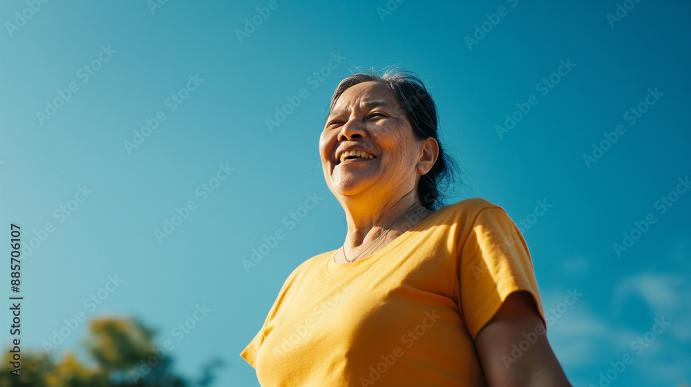 Woman smiling brightly outdoors on a sunny day. Woman smiling brightly outdoors on a sunny day.