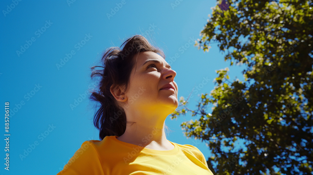 Woman smiling brightly outdoors on a sunny day. Woman smiling brightly outdoors on a sunny day.