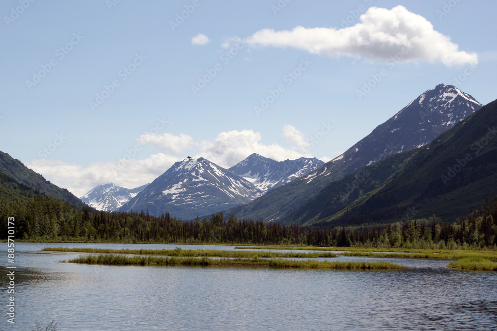 View somewhere between Cooper’s Landing and Turnagain Arm in Alaska. If you look closely at the mountain, you can see a plane just coming over the mountain. View somewhere between Cooper’s Landing and Turnagain Arm in Alaska. If you look closely at the mountain, you can see a plane just coming over the mountain.