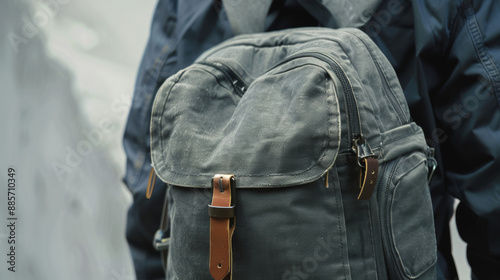 "Closeup of a gray backpack rotating on a white background."