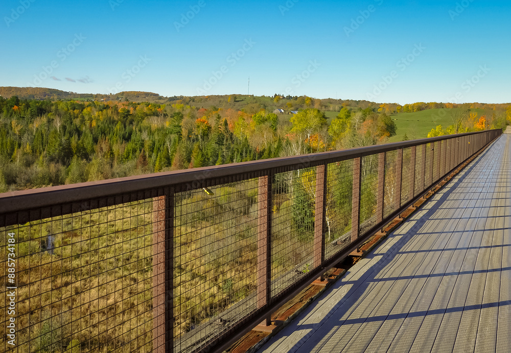 Bridge overlooking landscape with trees in autumn Bridge overlooking landscape with trees in autumn