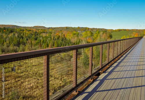 Bridge overlooking landscape with trees in autumn photo