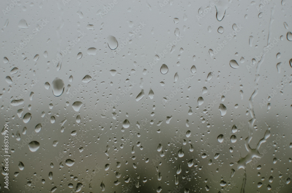 raindrops on the window during a strong hurricane with wind in nature raindrops on the window during a strong hurricane with wind in nature